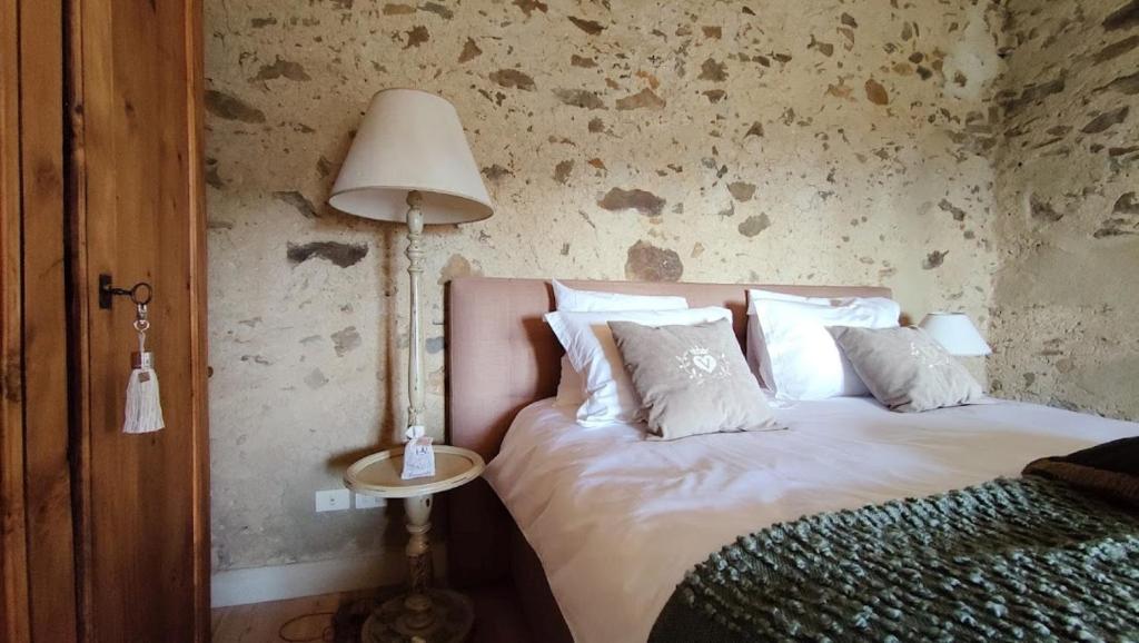 A bed or beds in a room at Podere Le Vedute