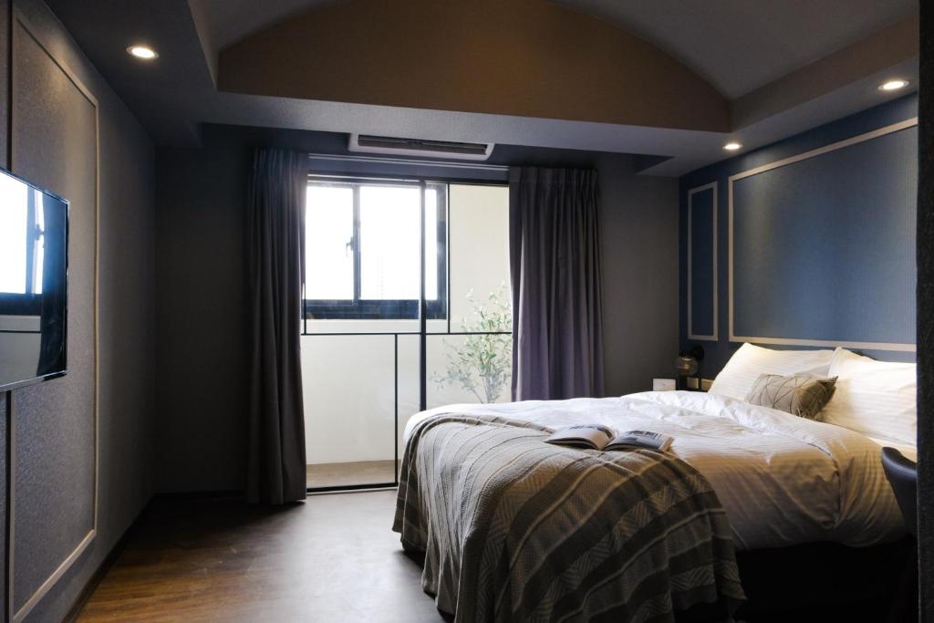 Postel nebo postele na pokoji v ubytování Giant Rich Hotel