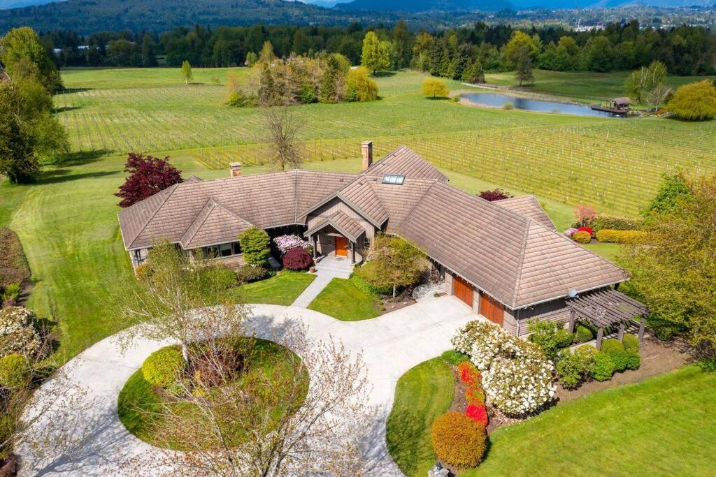 an aerial view of a large house with a garden at Season Premiere Winery-Bed & Breakfast in vineyard in Abbotsford