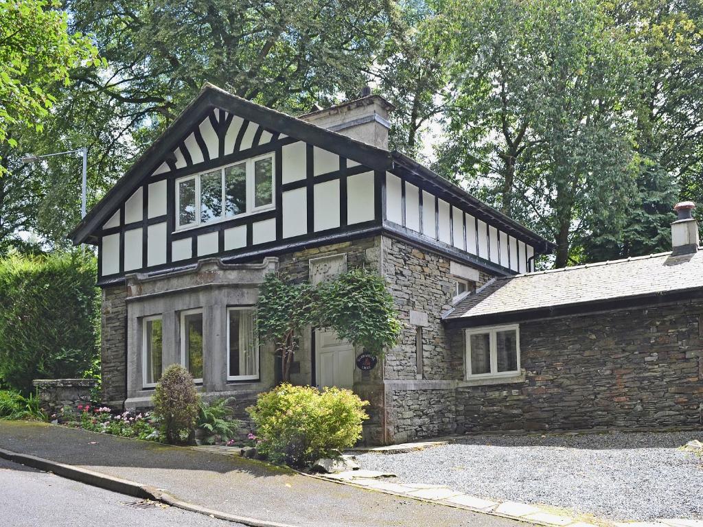 a house with a black and white roof at Hammer Bank Lodge in Windermere