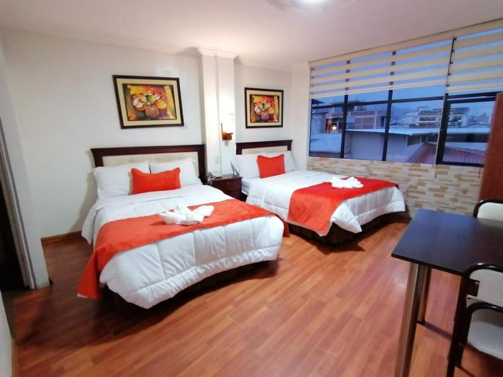 Postel nebo postele na pokoji v ubytování Hotel Virgen del Cisne