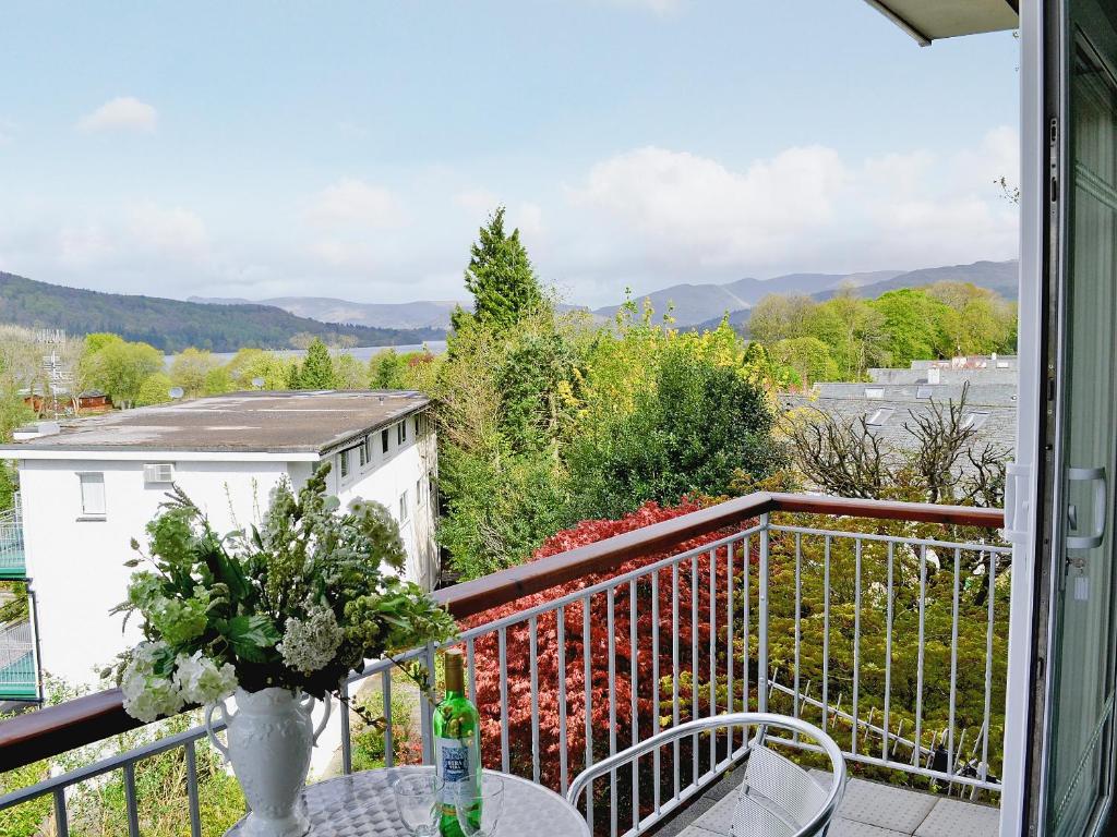 a balcony with a table and chairs and a view at Lake View in Bowness-on-Windermere