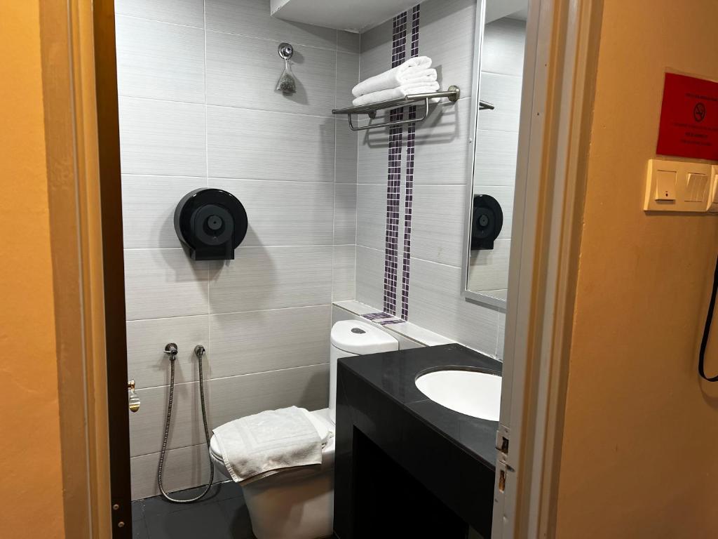 Koupelna v ubytování Signature Hotel