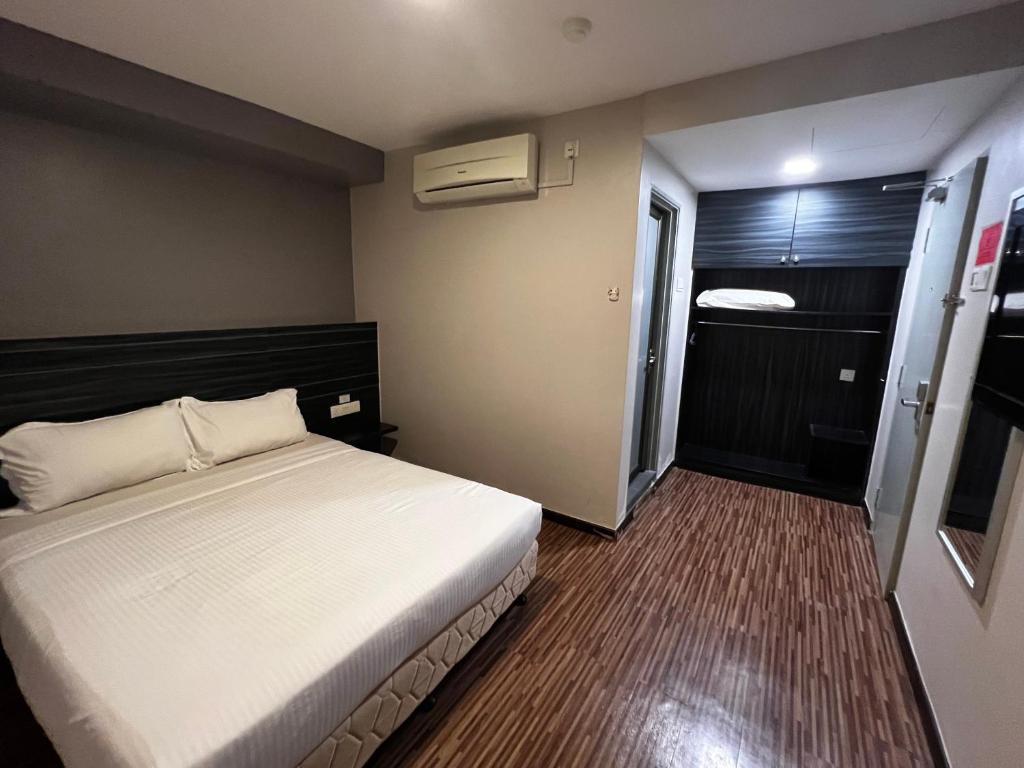 Postel nebo postele na pokoji v ubytování Signature Hotel