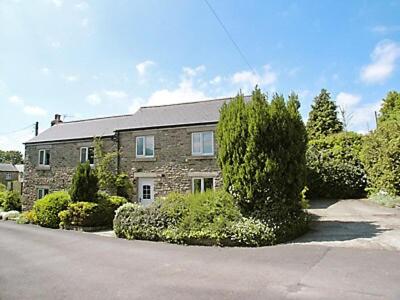 a large brick house with trees in front of it at Bestdale in Frosterley