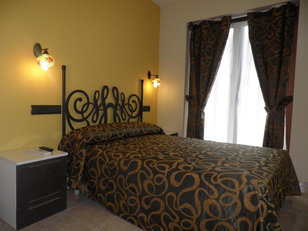 Postel nebo postele na pokoji v ubytování Hotel Meson de L’Ainsa