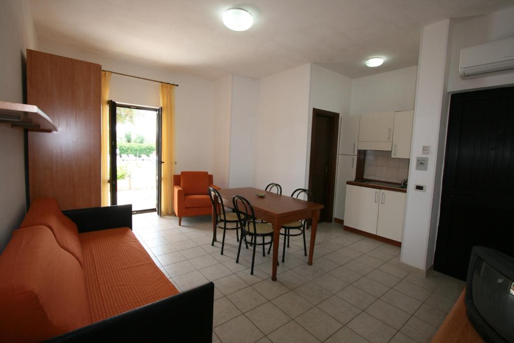 a living room with a couch and a table at Residence Club Barbara in Ostuni