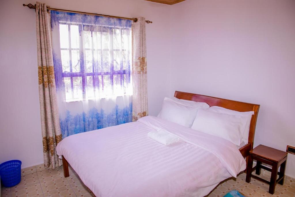 Postel nebo postele na pokoji v ubytování Hope Homestay