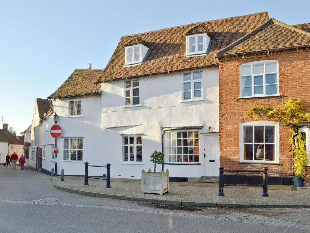 a white building on the side of a street at Red Lion Corner in Lavenham