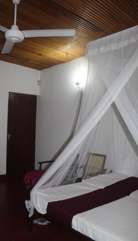 Ένα ή περισσότερα κρεβάτια σε δωμάτιο στο Lazy Bear Best Hostel in Kandy