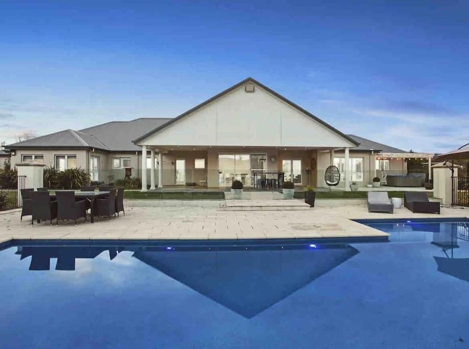 a house with a swimming pool in front of it at The York Residence in Hartley NSW - Newly Listed in Hartley