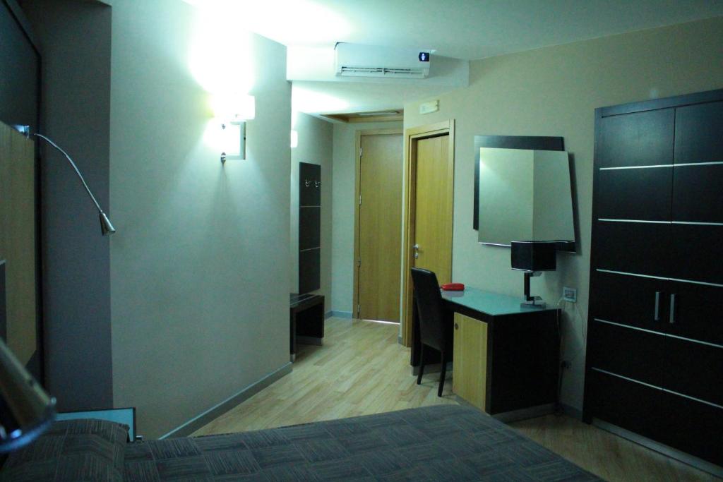 Letto o letti in una camera di Hotel Ginepro