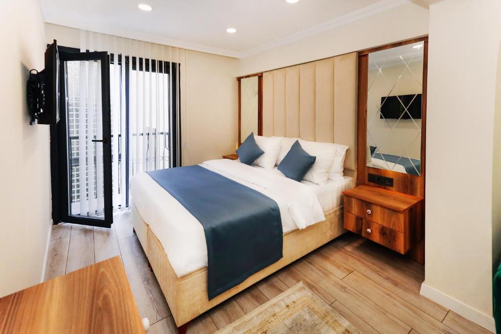 Säng eller sängar i ett rum på Galata Master Hotel