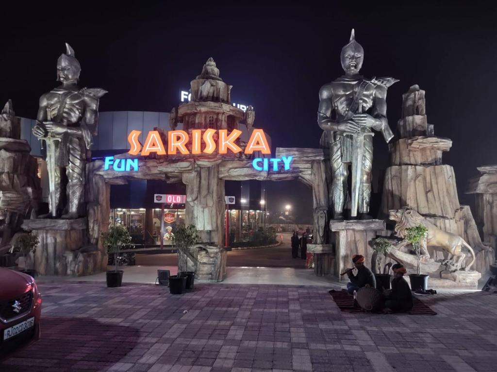 a group of people sitting in front of a santasana city at night at CLUB 21 by Sariska Fun City, Alwar in Mācheri