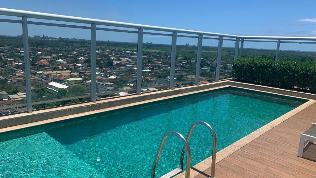 Bazén v ubytování Itaguaí Flat - Centro nebo v jeho okolí