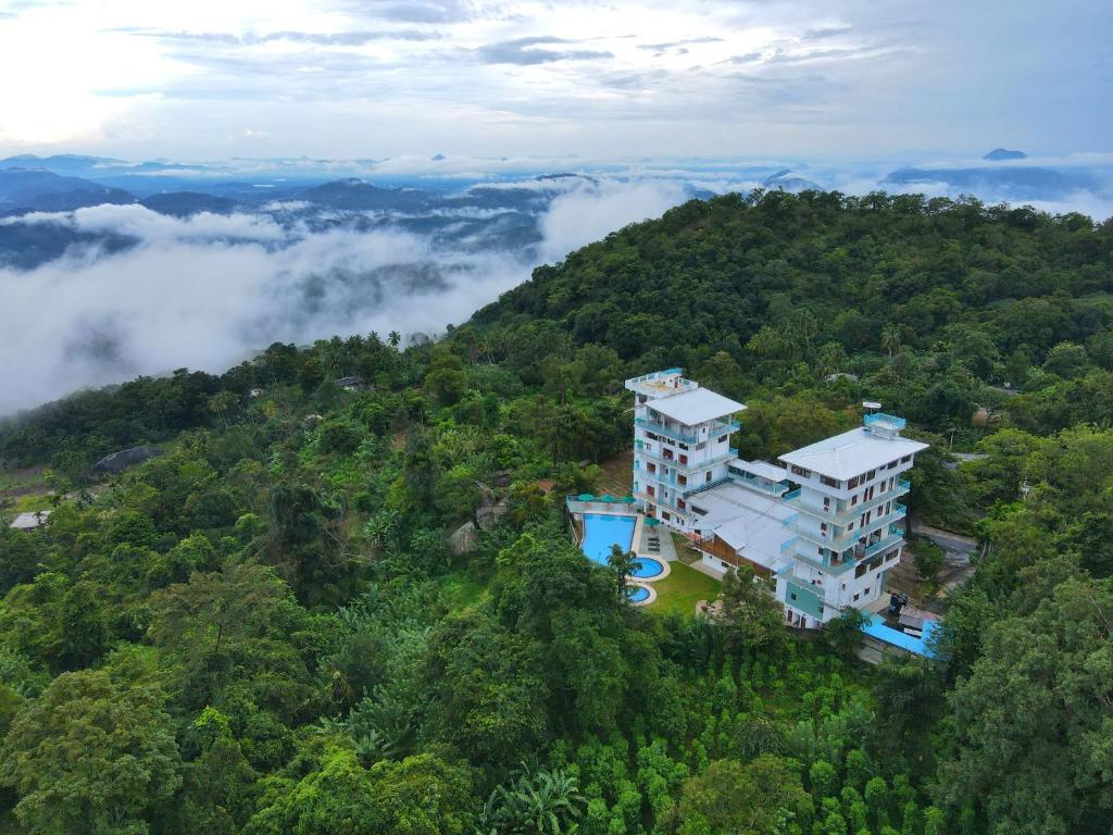 an aerial view of a building on a hill in the forest at Moi Ella by DBI in Ella