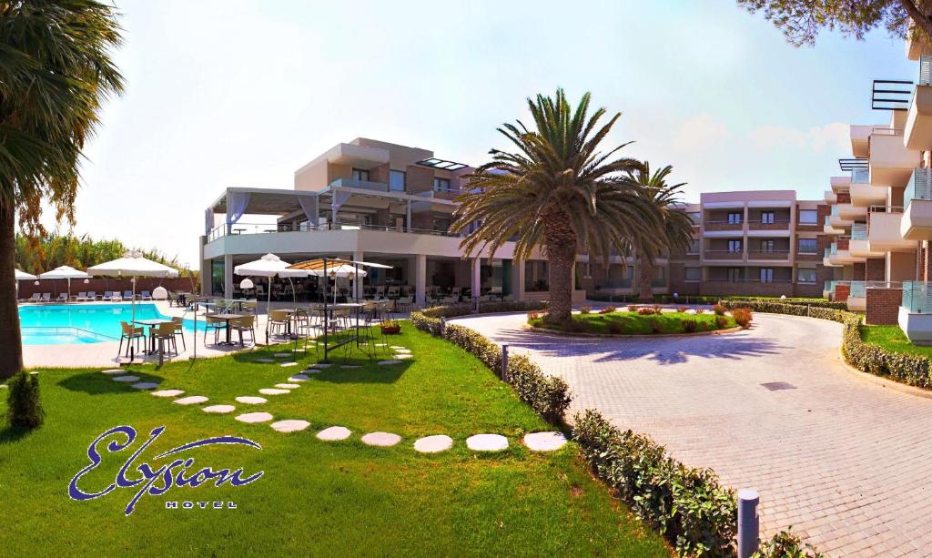 a resort with a swimming pool and a resort at Elysion Hotel in Mytilene