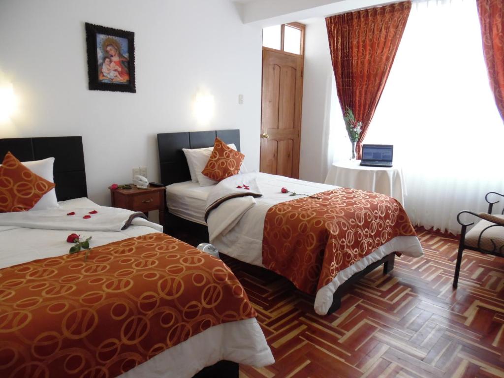Postel nebo postele na pokoji v ubytování Hotel Puno Terra
