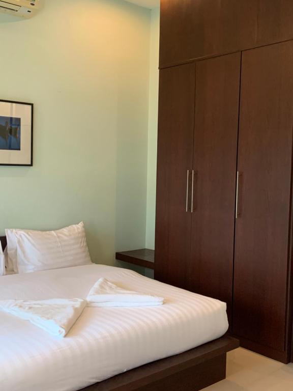 Postel nebo postele na pokoji v ubytování บ้านธานี (BAAN THANI)