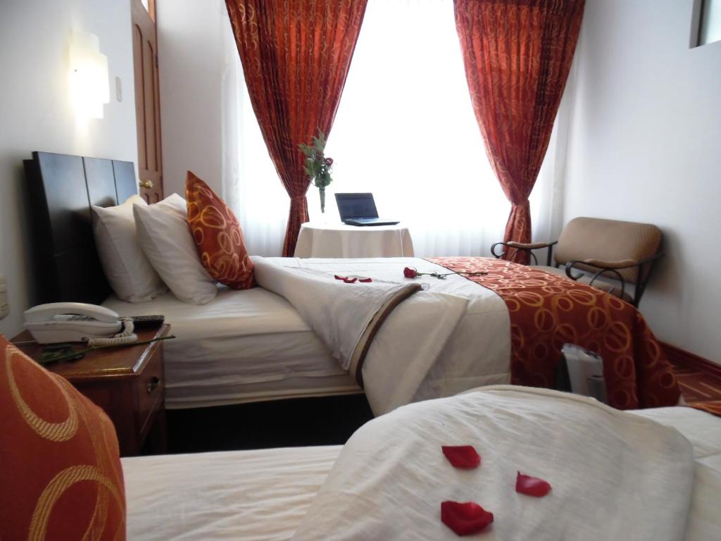 Postel nebo postele na pokoji v ubytování Hotel Puno Terra