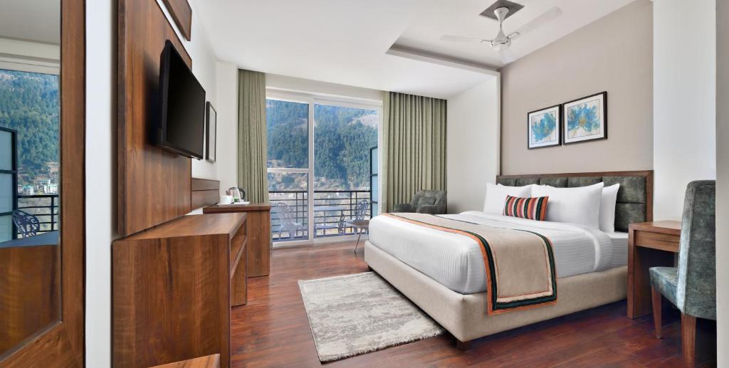 Postel nebo postele na pokoji v ubytování juSTa Grand View Resort & Spa, Manali