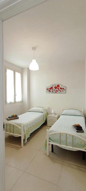 Postel nebo postele na pokoji v ubytování La Casetta 22