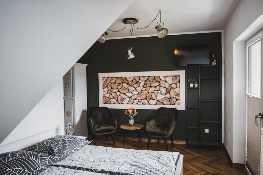 Un pat sau paturi într-o cameră la Płazowianka