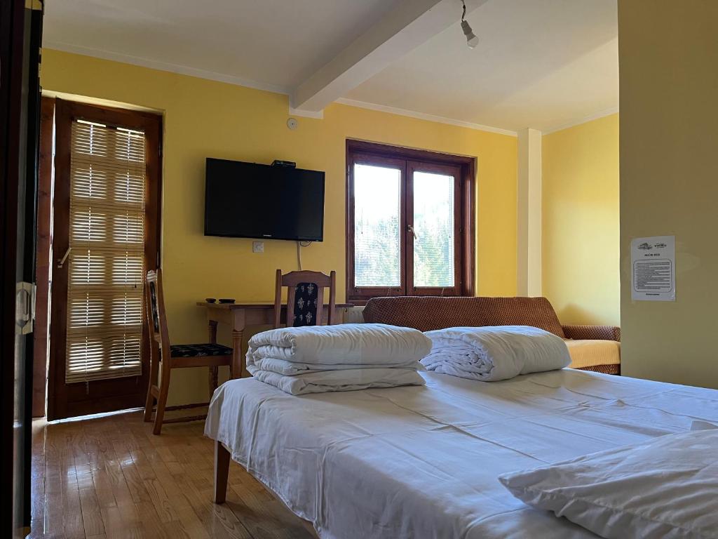 Rúm í herbergi á Apartments and Rooms Vicko