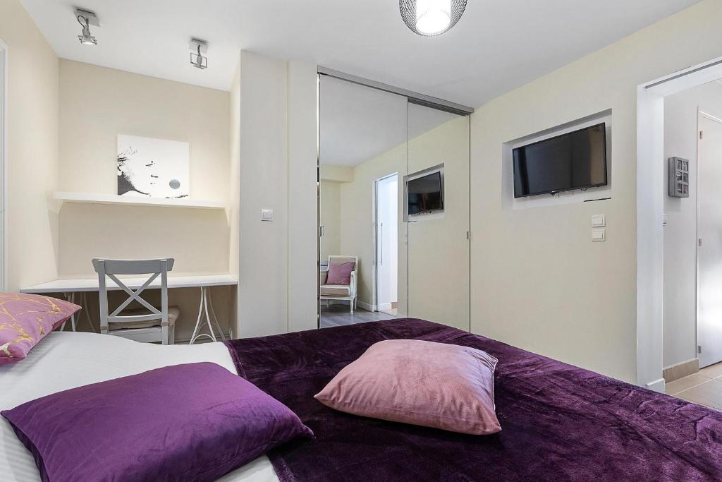 Posteľ alebo postele v izbe v ubytovaní Village Naturiste R4N - Le Cassis Heliopolis Luxe