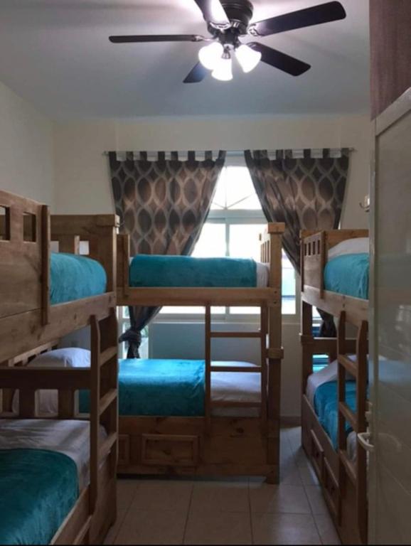 Postel nebo postele na pokoji v ubytování Hostal Bucerias