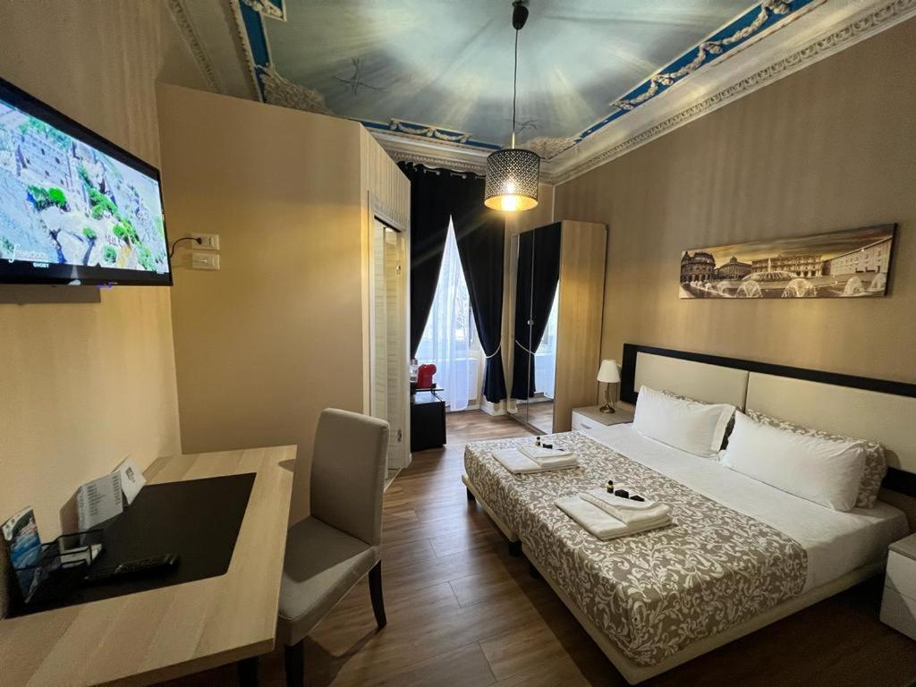 TV a/nebo společenská místnost v ubytování Domus La Foce Hotel
