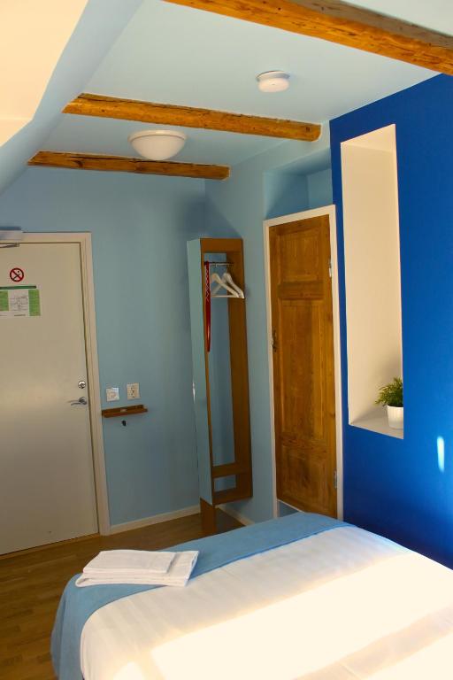 Postel nebo postele na pokoji v ubytování Magles Smiley Inn