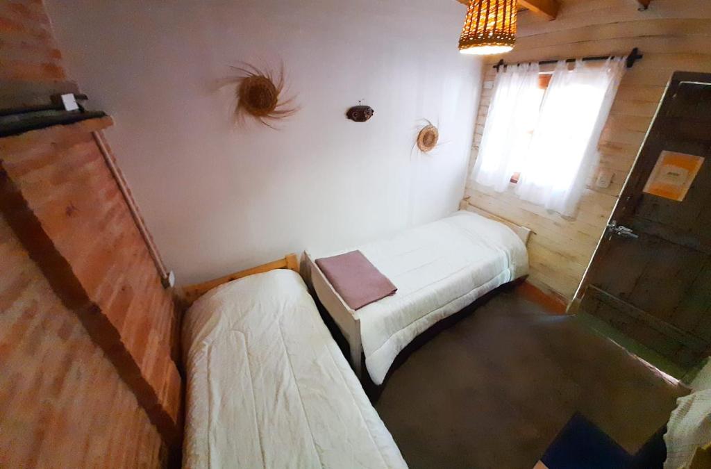 Postel nebo postele na pokoji v ubytování Cielito Lindo