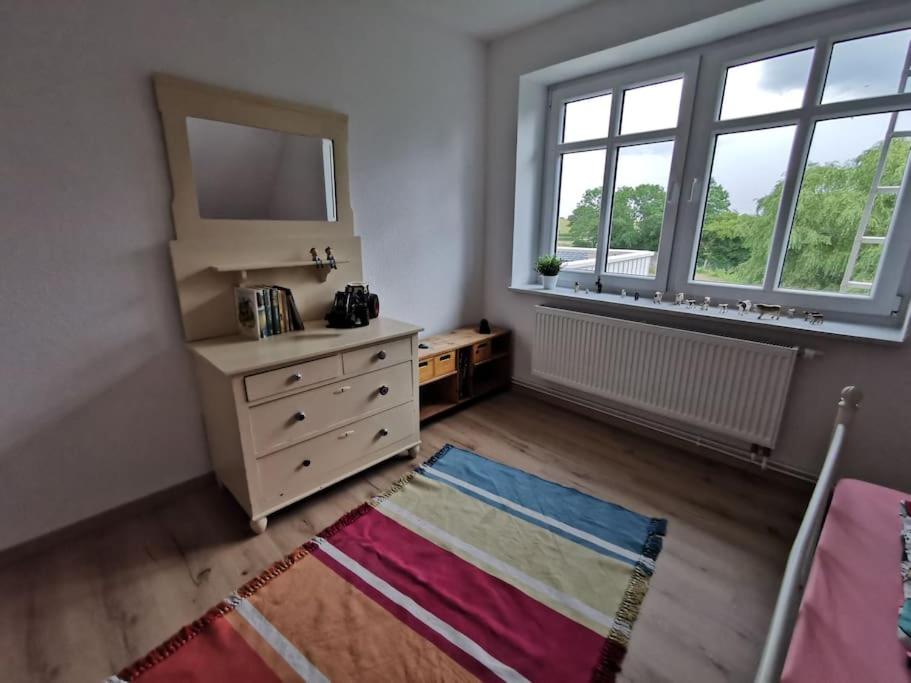 Postel nebo postele na pokoji v ubytování Ostseeblick im Andersenhof