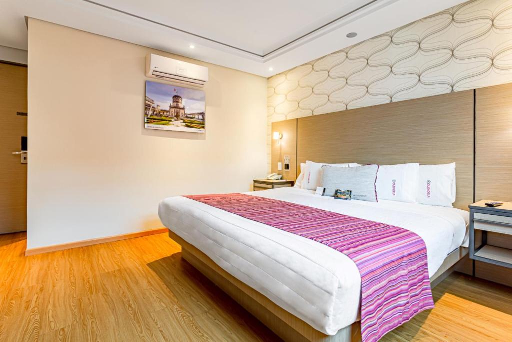 Łóżko lub łóżka w pokoju w obiekcie Kali Ciudadela Mexico City