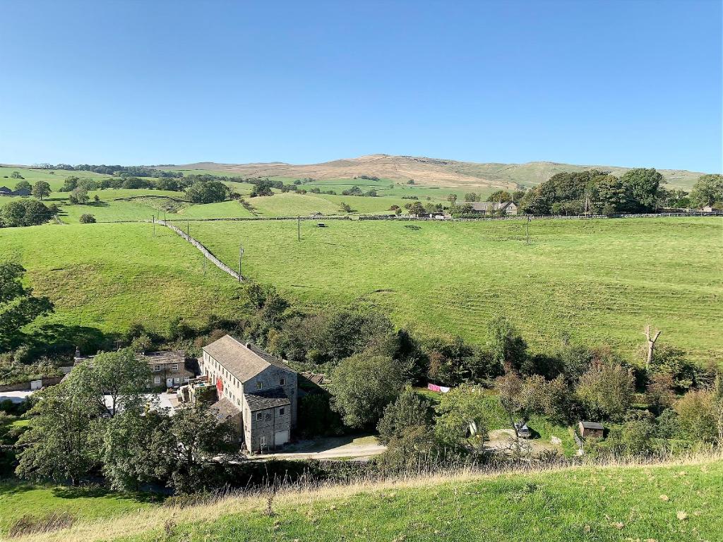 an aerial view of a house in a field at Dipper in Malham