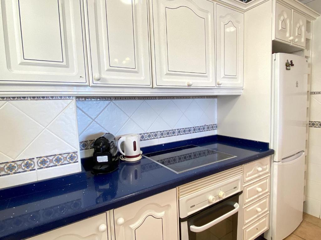 Kuchyň nebo kuchyňský kout v ubytování Milenio 1H Apartments Casasol