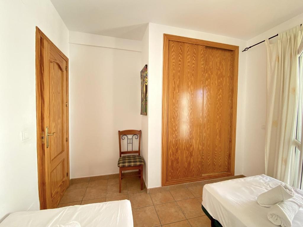 Postel nebo postele na pokoji v ubytování Milenio 1H Apartments Casasol