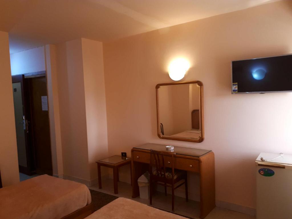 TV a/nebo společenská místnost v ubytování New Pola Hotel