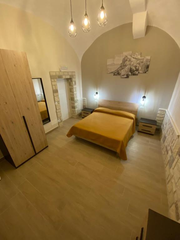 Postel nebo postele na pokoji v ubytování Dimora Vesuviana