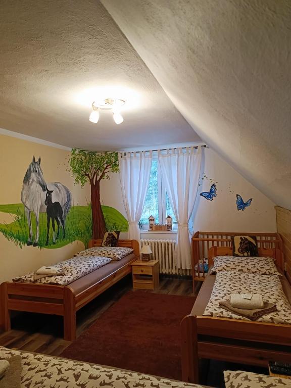 Postel nebo postele na pokoji v ubytování Jízdárna Malenovice