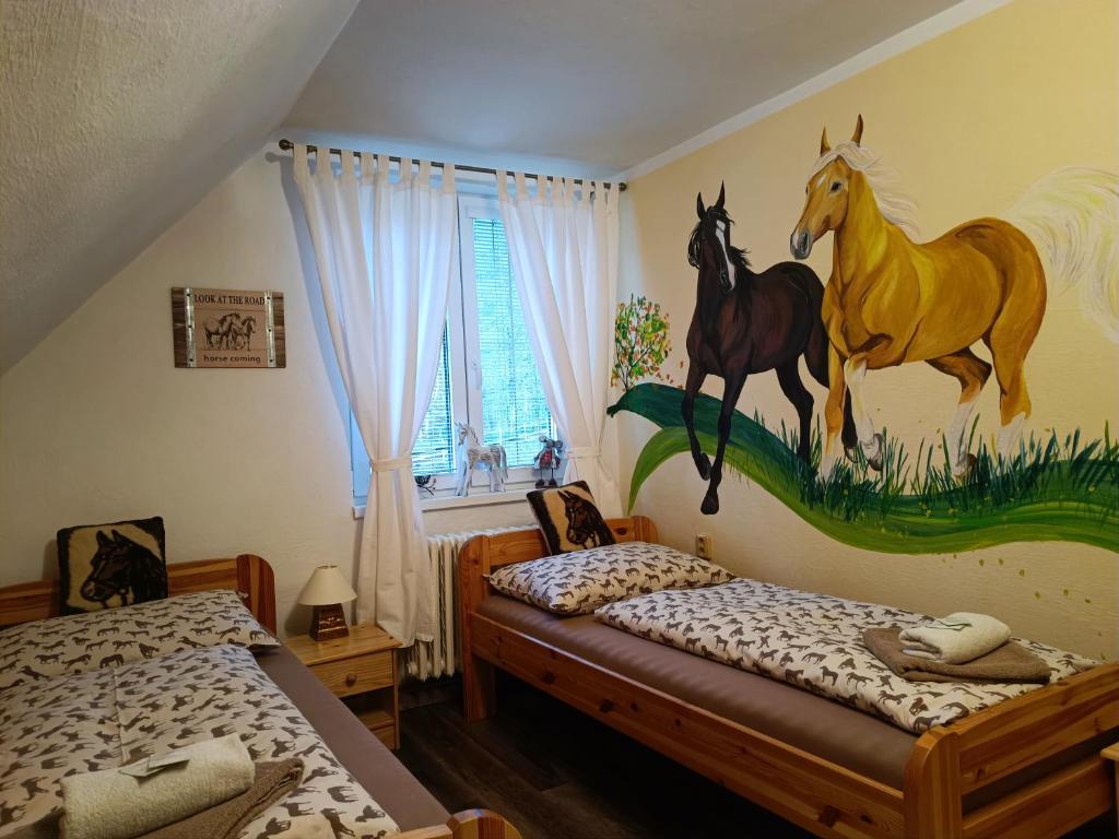 Postel nebo postele na pokoji v ubytování Jízdárna Malenovice