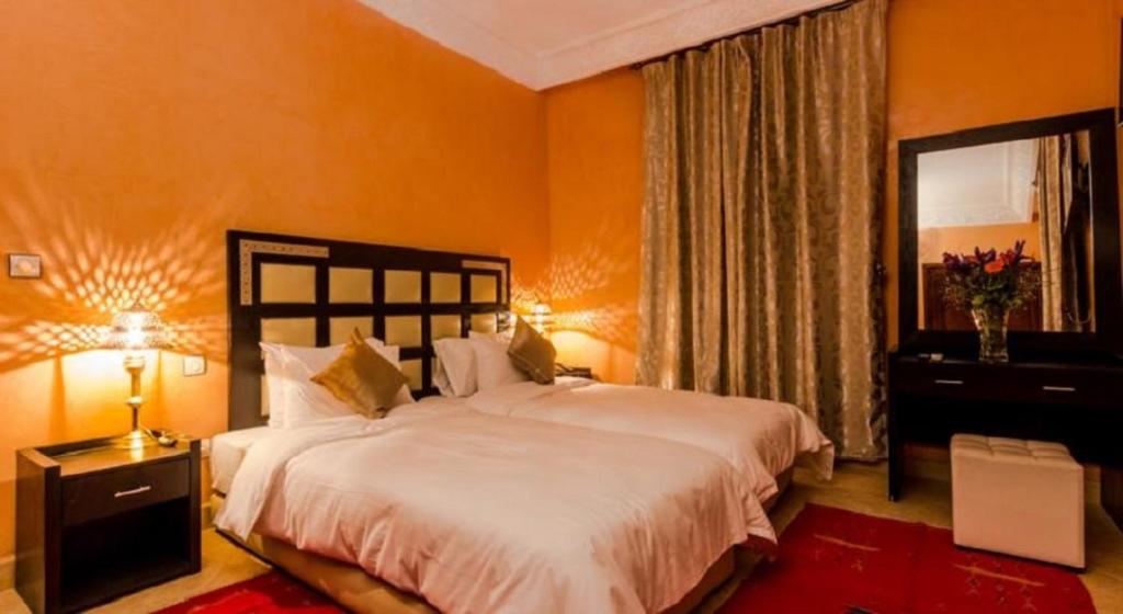 Postel nebo postele na pokoji v ubytování Marrakech House