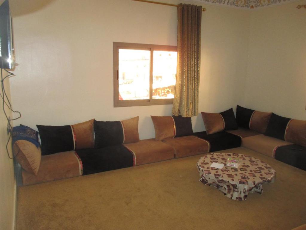 a living room with a couch and a window at إقامة وادي الذهب in Dakhla