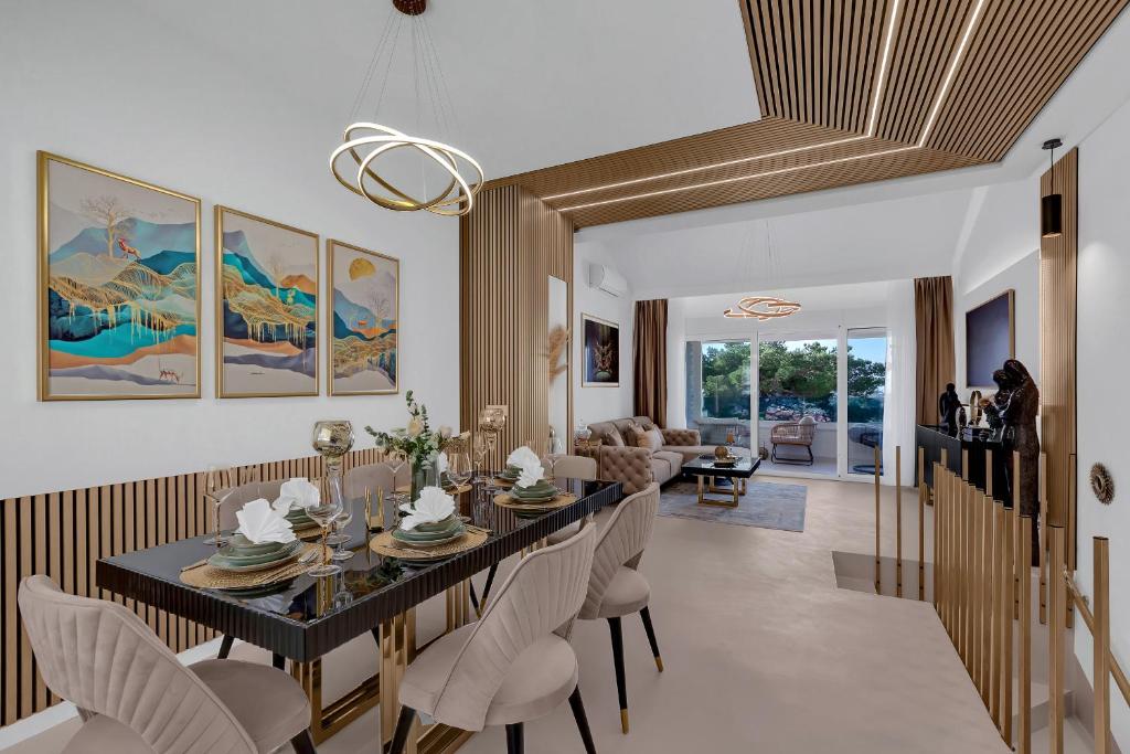 a dining room with a table and chairs at The Luxury Goldenhour in Makarska