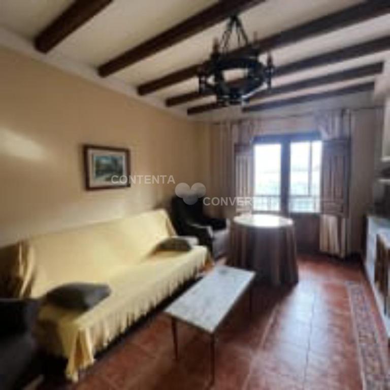A seating area at Apartamentos Turísticos La Posada