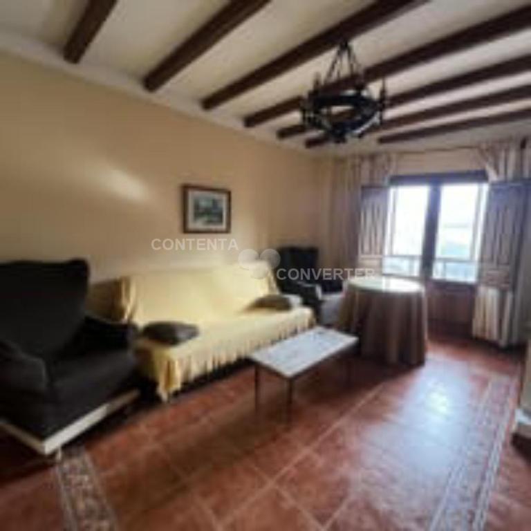 A seating area at Apartamentos Turísticos La Posada