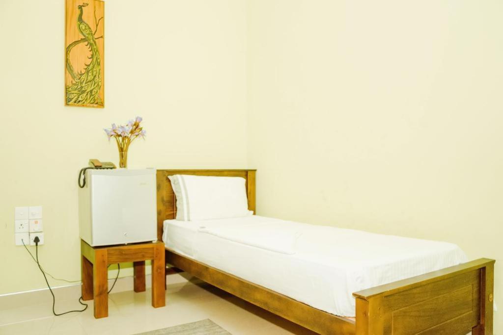Postel nebo postele na pokoji v ubytování Upul Residence
