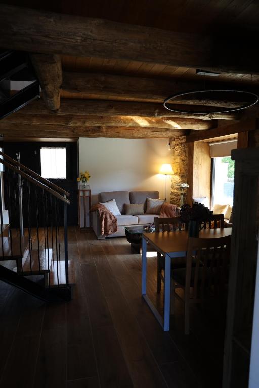 A bed or beds in a room at Casa Os Prados da Albela