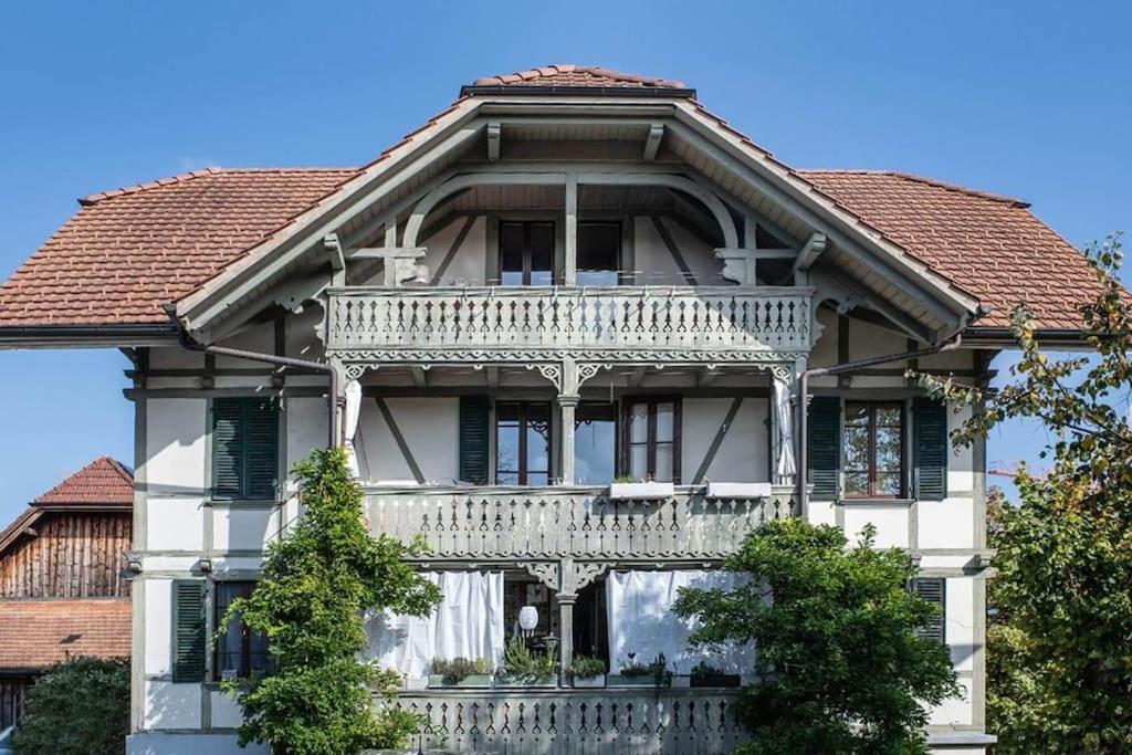 a house with a balcony on the front of it at Hadassa Apartments Navah in Uetendorf
